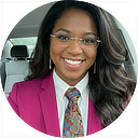 Eugénie wearing a suit and tie.